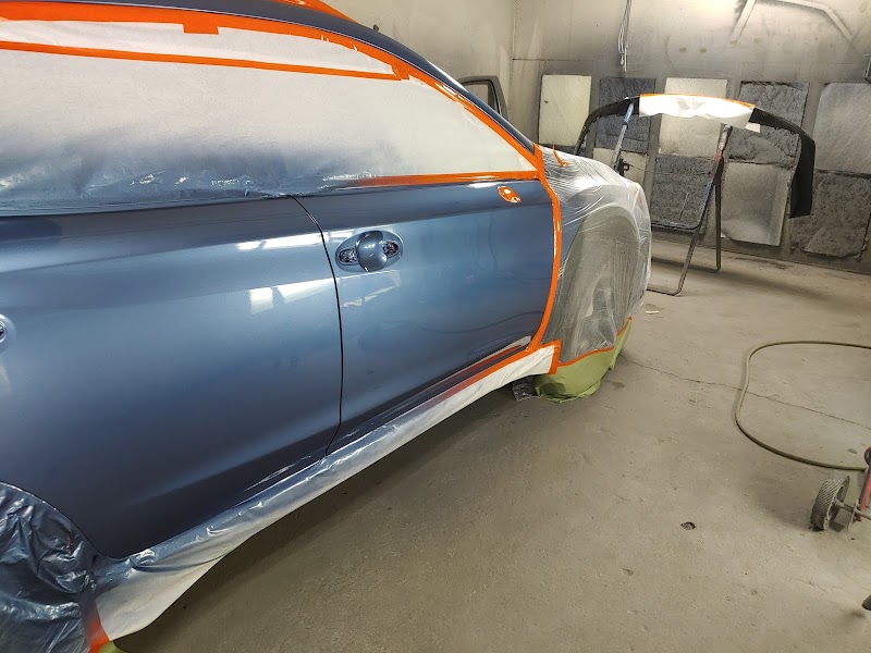 Bumper repair in progress, showing attention to detail and paint matching.
