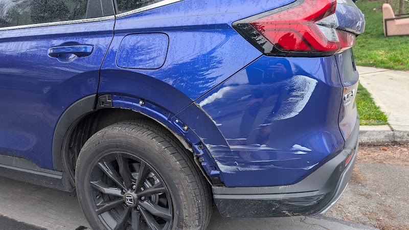 Before and after: hit-and-run fender restored to original condition.