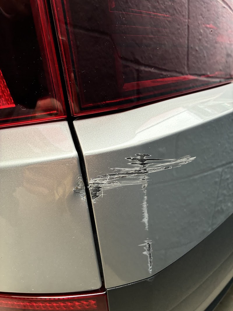 Team member performing detailed cosmetic repair.