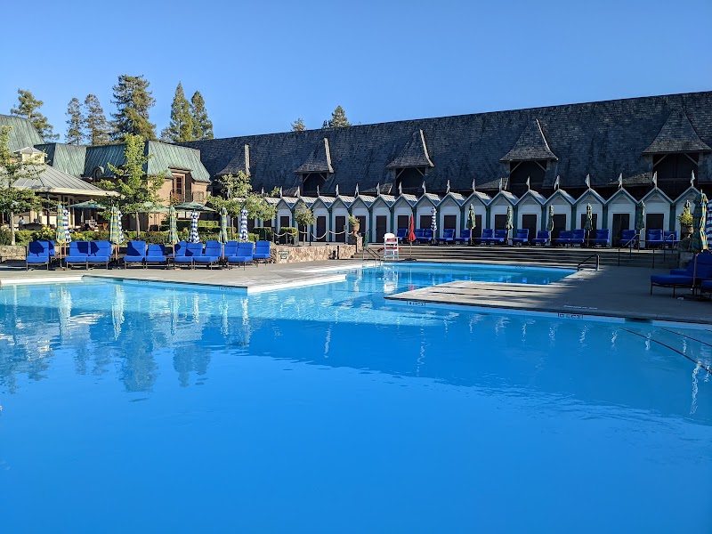Pool with cabanas featuring lockable changing rooms and showers