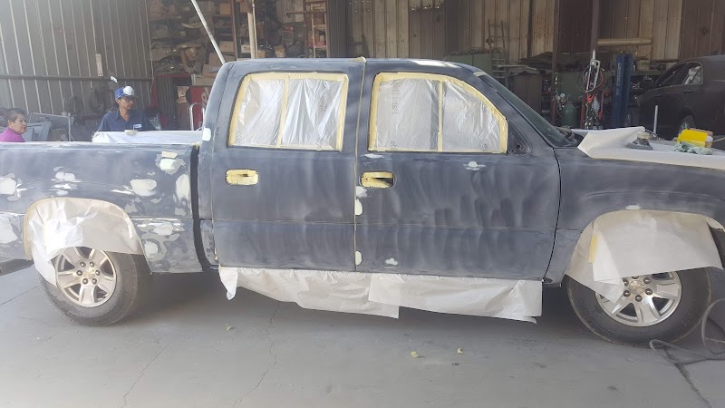 Collision repair in progress, showing detailed structural work.