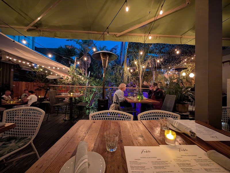 Charming garden patio with heaters and a mini rainforest
