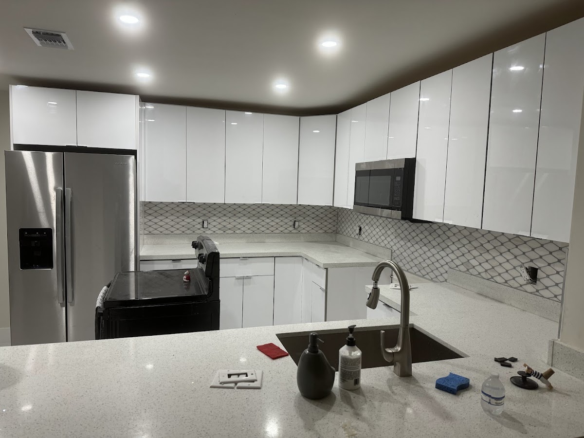 Modern kitchen with dark cabinets and wood accents