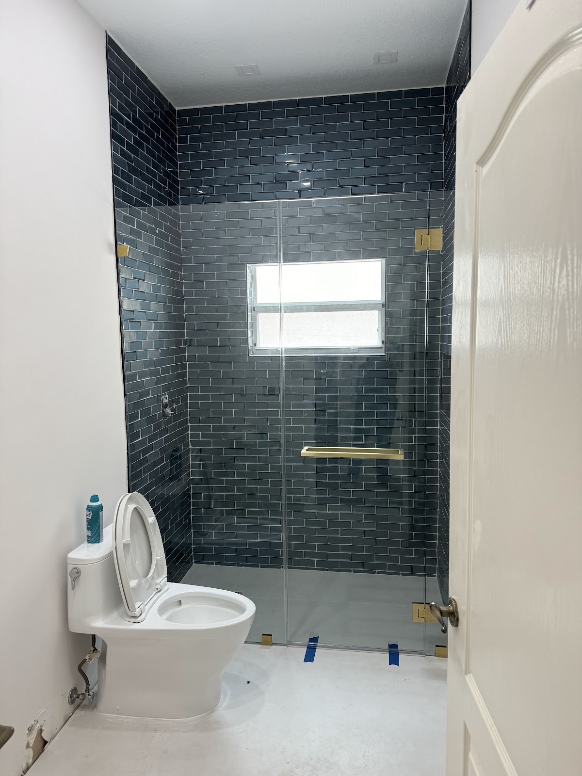 Staircase remodel with dark treads and metal railing