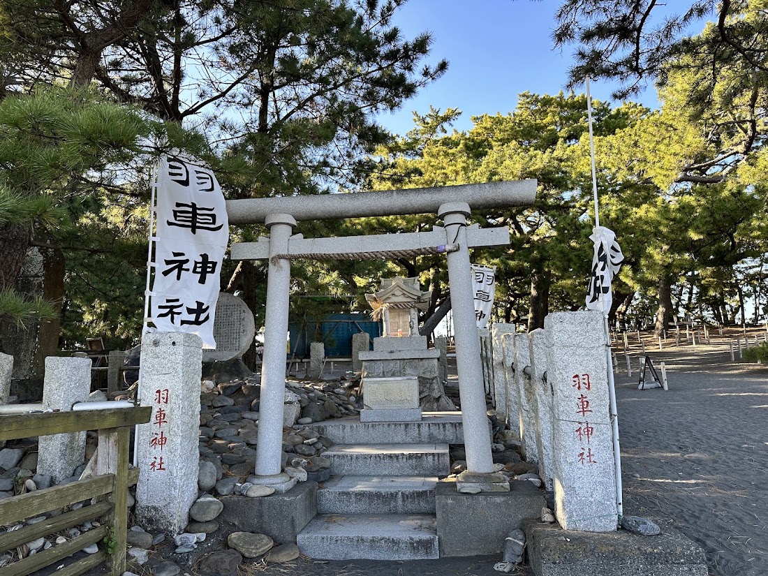 The white torii of Hagoruma Shrine beside the Hagoromo pine at Miho