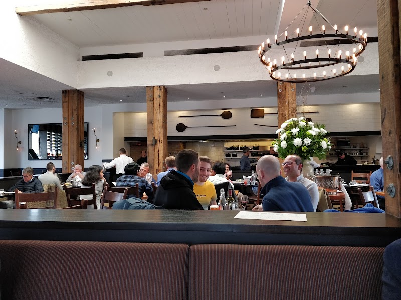 Open kitchen with airy, high-ceiling dining room