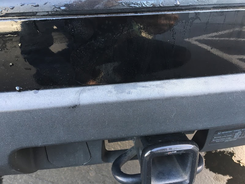 Before-and-after of a truck with 20 years of dents and rust completely restored to factory condition