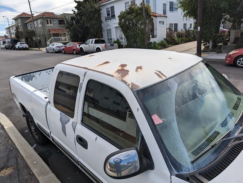 In-progress collision repair showing detailed structural work and panel alignment