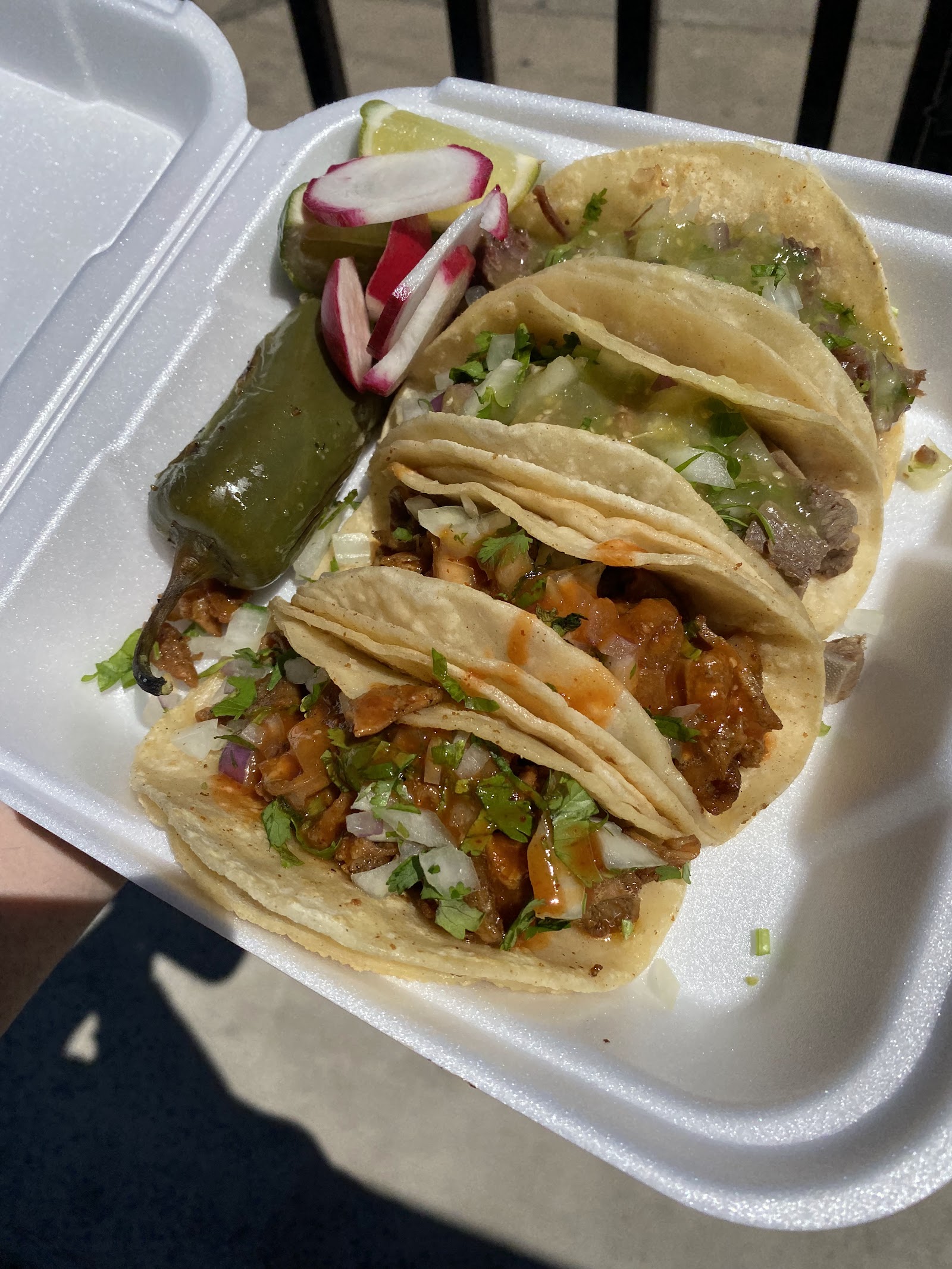 A plate of tacos from Tacos La Fuente