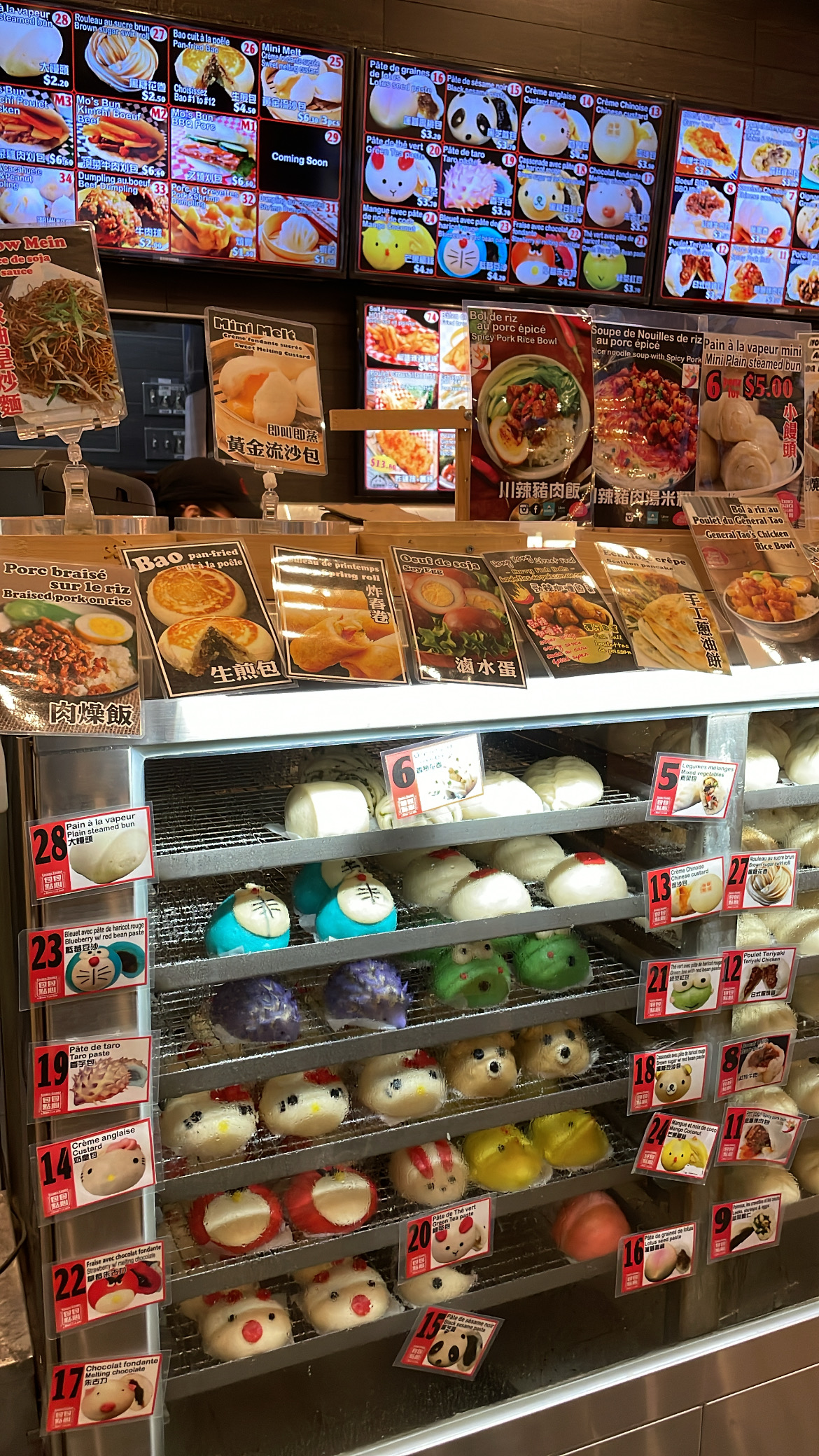 Rows of delicate tarts with fruit and cream