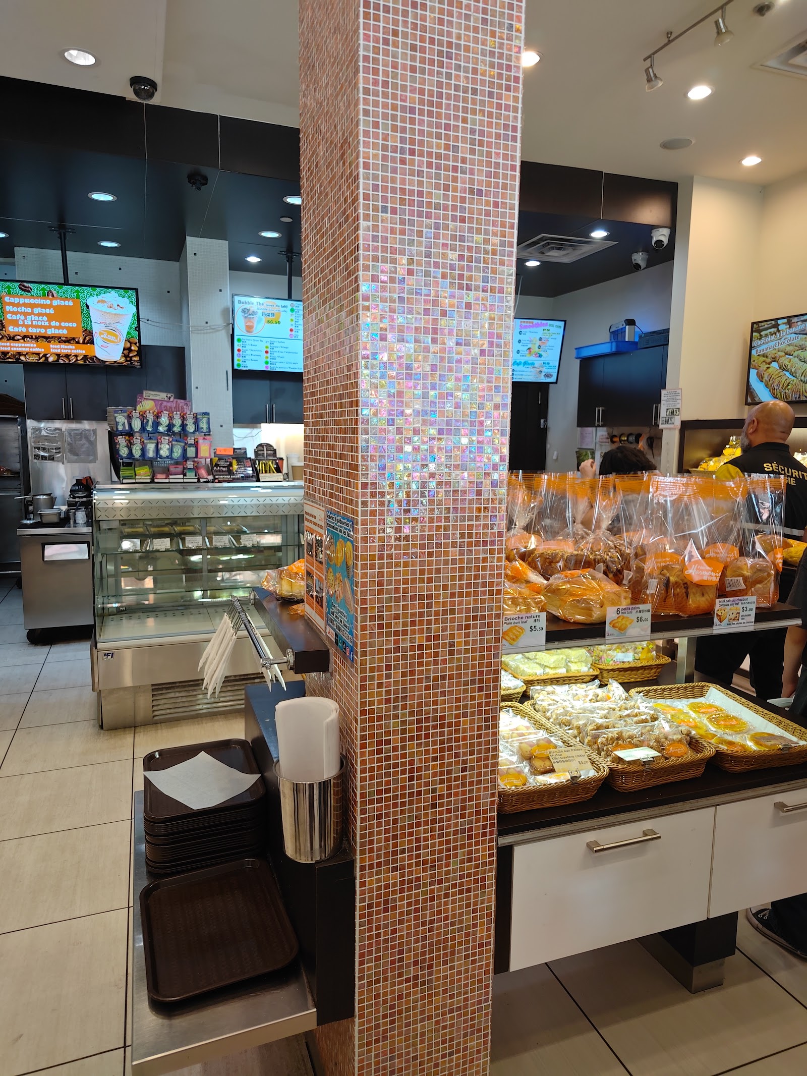 Various croissants and pastries displayed in a glass case