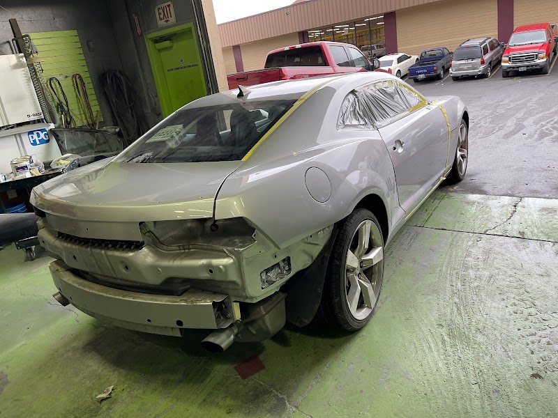 Team focused on precision alignment and body work