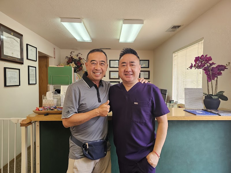 Dr. Xiong consulting with a patient and explaining their personalized treatment plan.