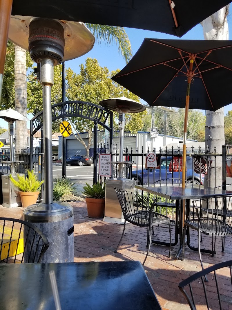 Shaded patio seating with a festive atmosphere