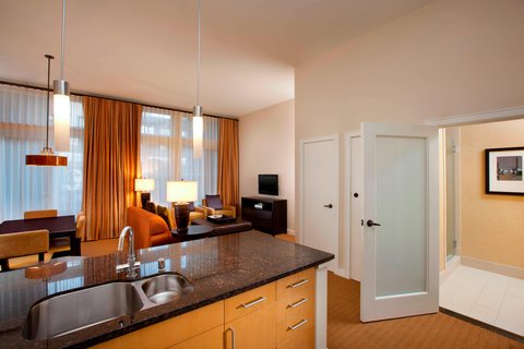 Rooms with kitchen amenities and high ceilings