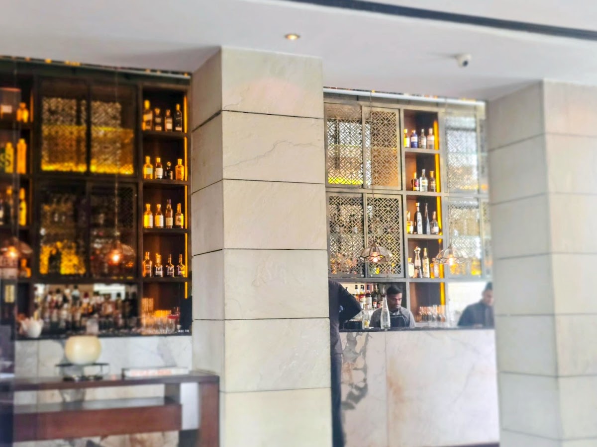 The sophisticated bar area at Indian Accent, showcasing their curated selection of premium spirits.