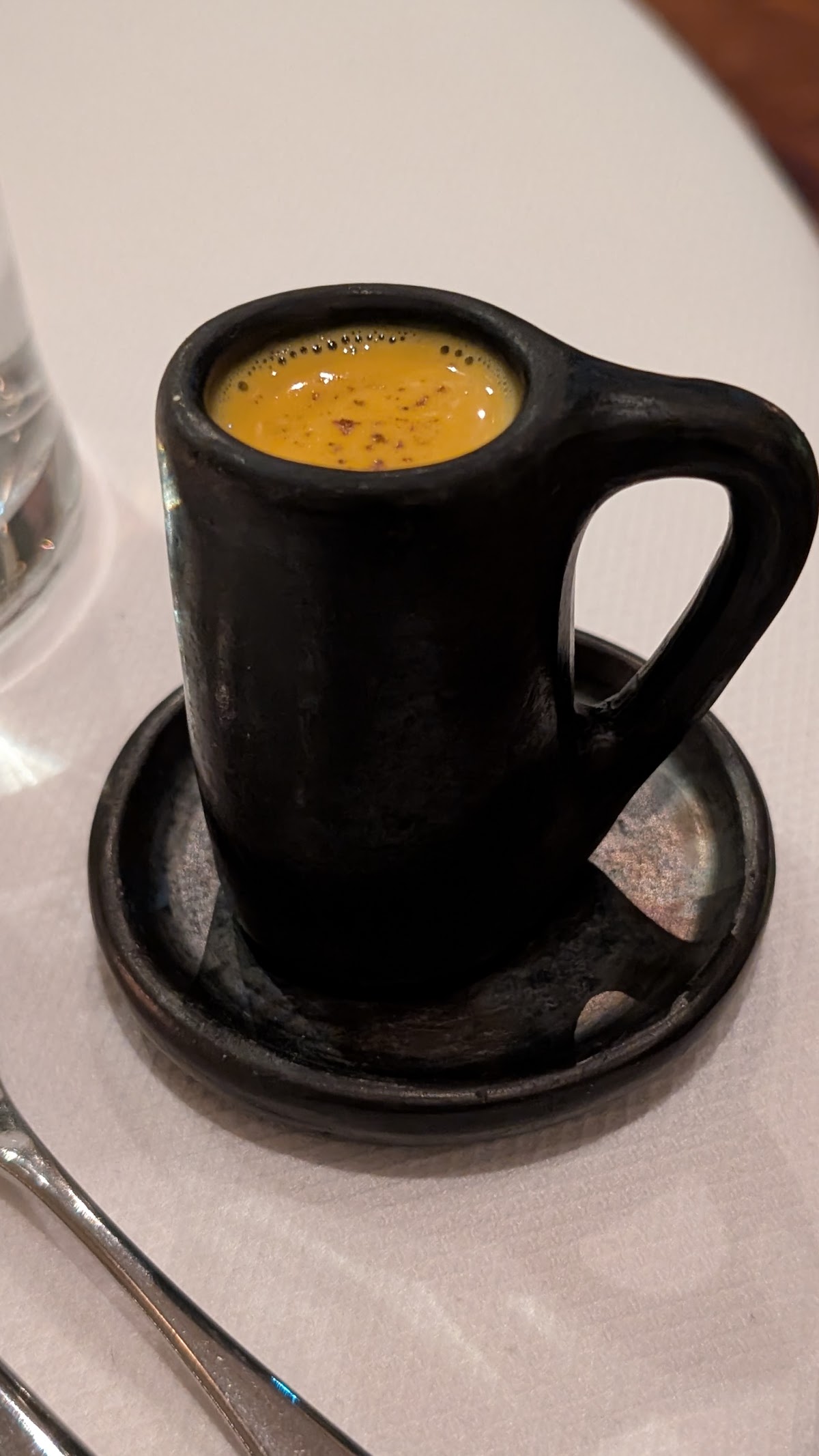 Indian Accent's signature amuse-bouche, elegantly served in rustic stoneware.