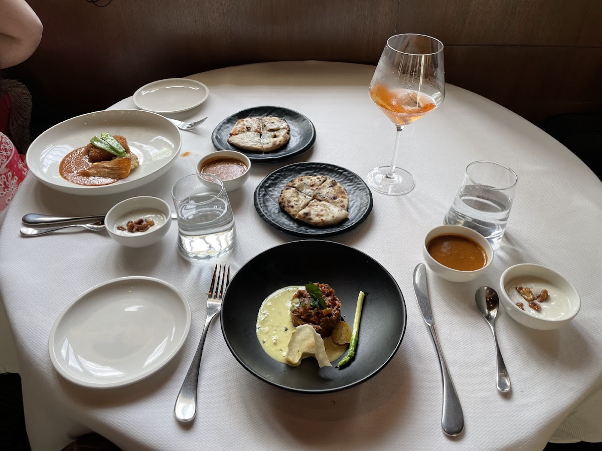 An elegant spread at Indian Accent showcasing their exquisite plating and fusion of flavors.