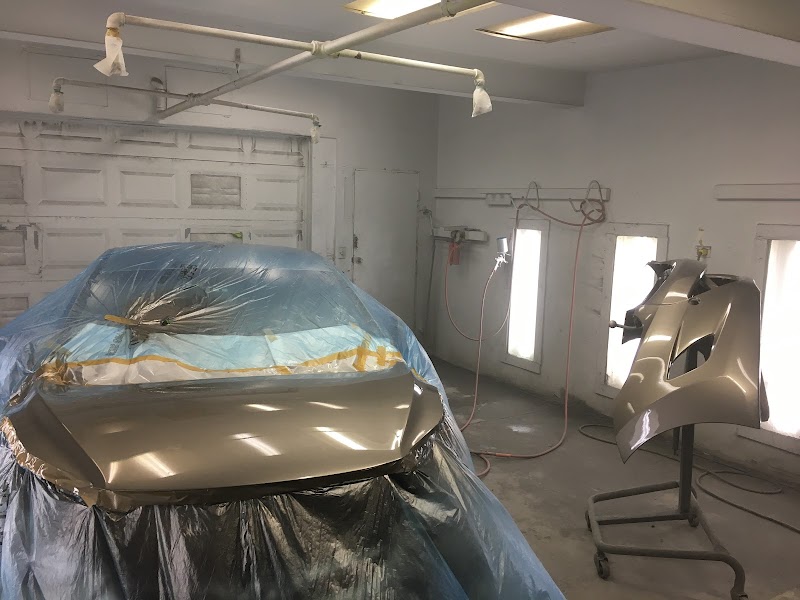 Collision damage repair work in the shop bay.