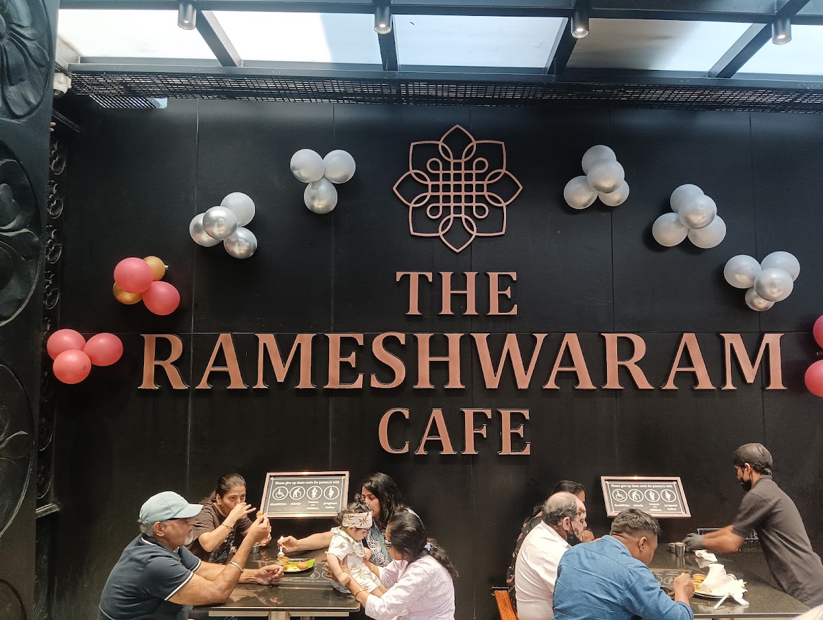 The Rameshwaram Cafe - Indiranagar's lively ambiance with a touch of celebration, capturing the essence of this vibrant eatery.