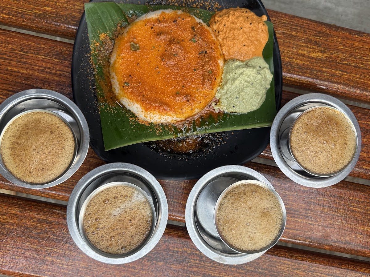 The Rameshwaram Cafe - Indiranagar's authentic dosa paired with vibrant chutneys and traditional filter coffee creates a warm, inviting experience.