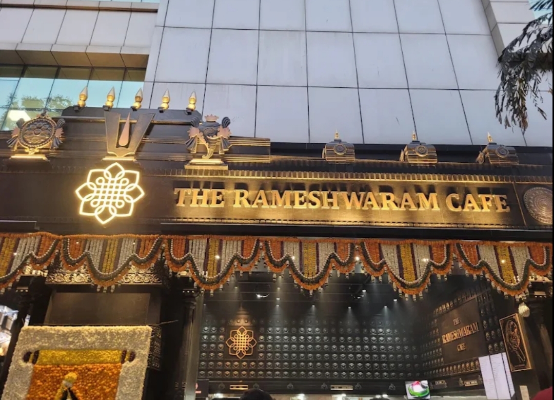 The Rameshwaram Cafe - Indiranagar's grand entrance, adorned with intricate designs and traditional décor, showcases its cultural elegance.