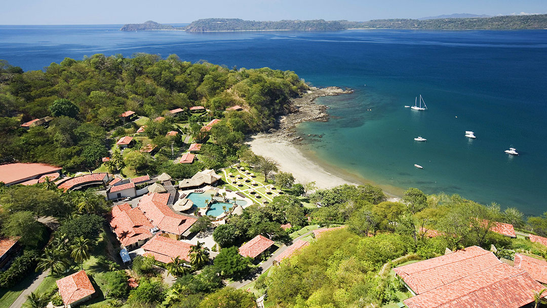 Private villa with plunge pool, lounge chairs, and ocean view at Secrets Papagayo Costa Rica.