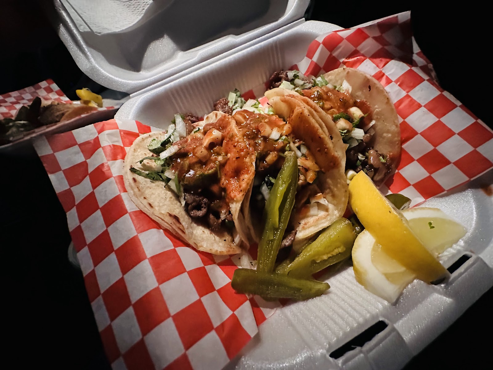 Loaded plate of tacos from Tacos El Catrin