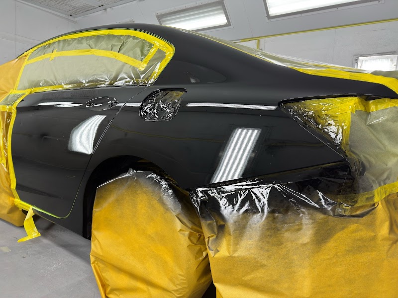 Custom paint application in progress, showing precision color matching and coverage.