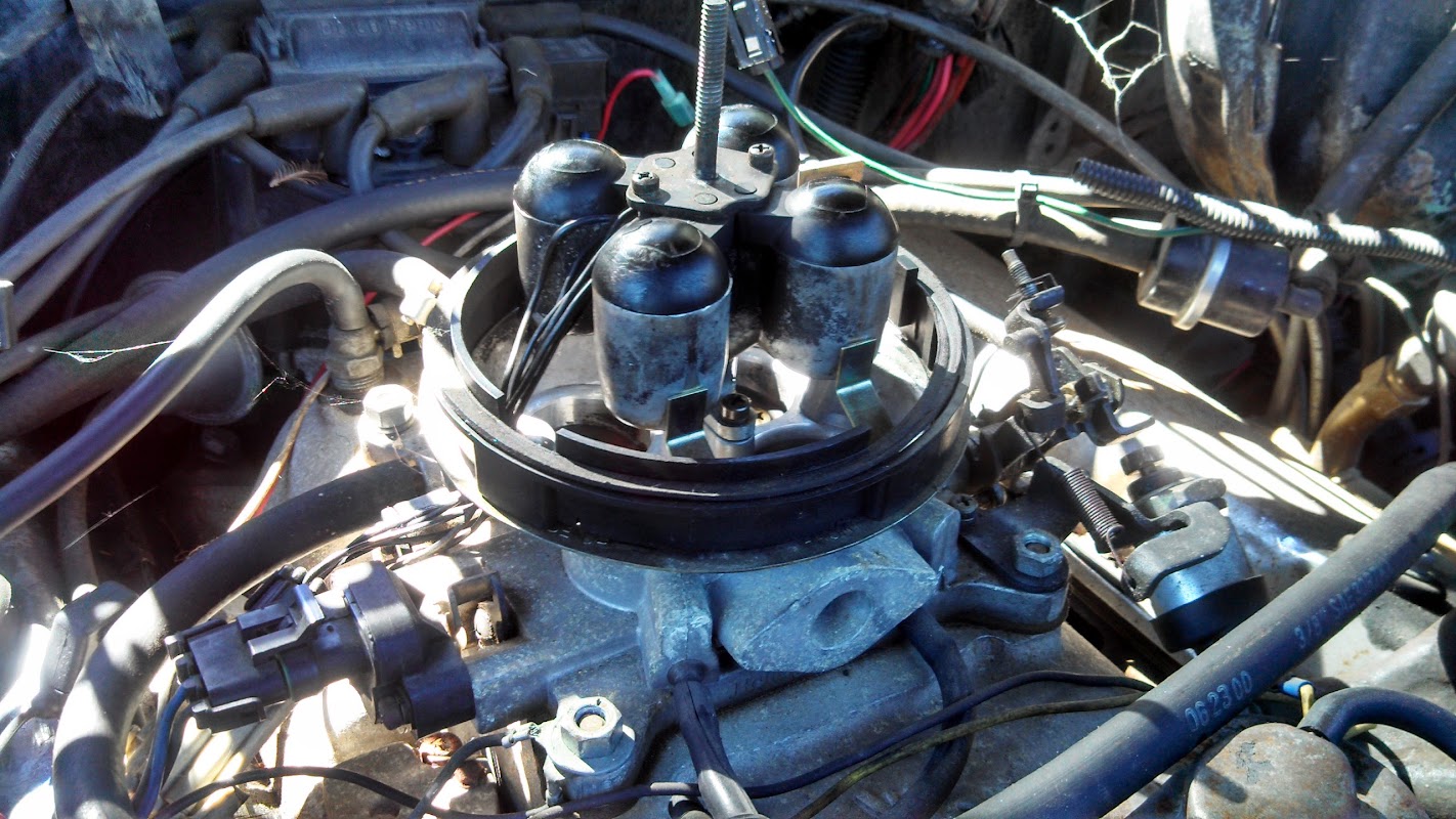 Mechanic working under the hood of a vehicle at San Ramon Auto Repair shop