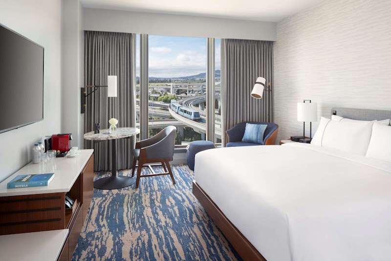 Soundproof rooms with runway views and plush bedding